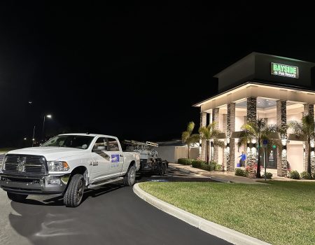 Image of a work truck in front of a commercial property.